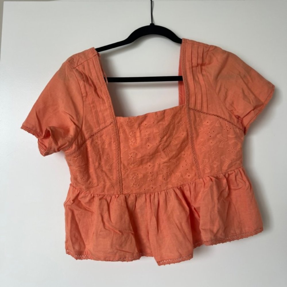 orange flowy shirt